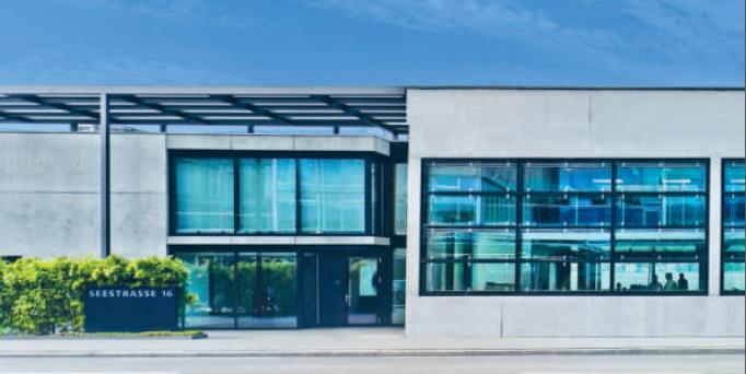 SPI-Musterdepot: Huber + Suhner – warum Anleger dabeibleiben und hohe Dividenden bei Bellevue Firmensitz Bellevue Grou